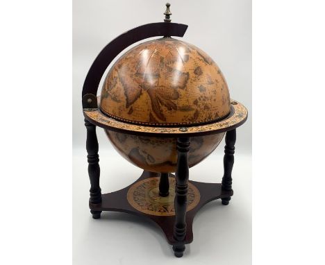 A table top drinks cabinet in the form of a terrestrial globe  