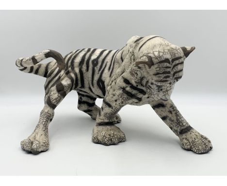 A Raku pottery model of a tiger signed K Rudge