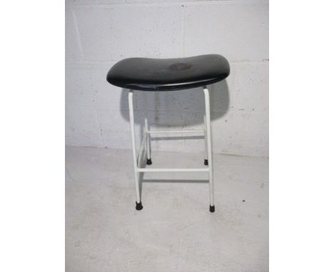 A retro metal framed stool with vinyl seat