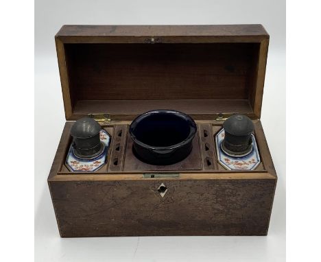 A mahogany tea caddy with blue glass mixing bowl and Chinese porcelain caddys with pewter hinged lids