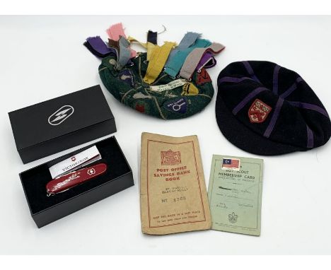 A vintage Cub Scout cap with many badges sewn on along with Scout penknife, Dulwich College cap etc. 