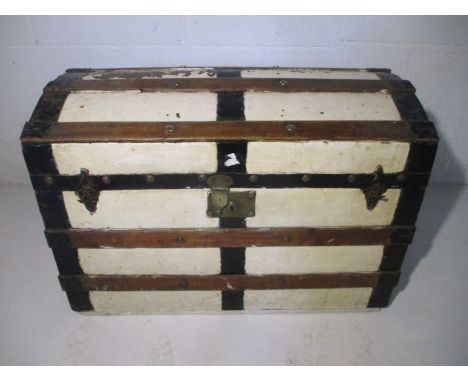 A vintage Saratoga dome topped trunk made by Thomas Russell, trunk manufacturers, Edinburgh.