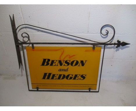 A vintage Benson and Hedges double sided metal advertising sign on cast iron bracket