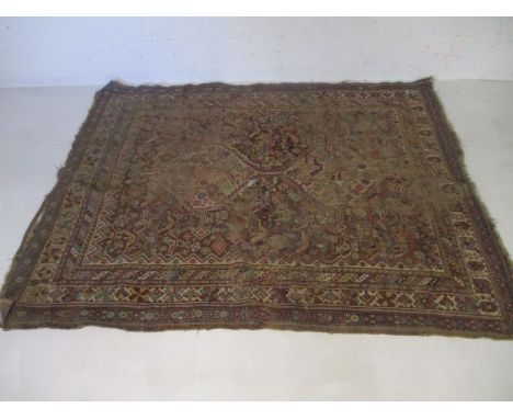 A vintage Eastern hand woven rug, 182cm x 150cm. A/F 