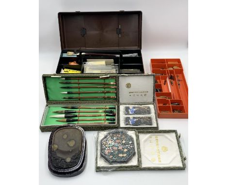 A collection of calligraphy and drawing equipment including a number of Chinese ink blocks 