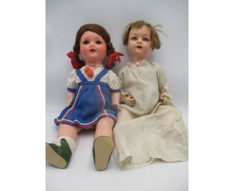 Two vintage dolls, one stamped Heubach Koppelsdorf, 320-2 and the other AM 2966,3/6 along with various doll books