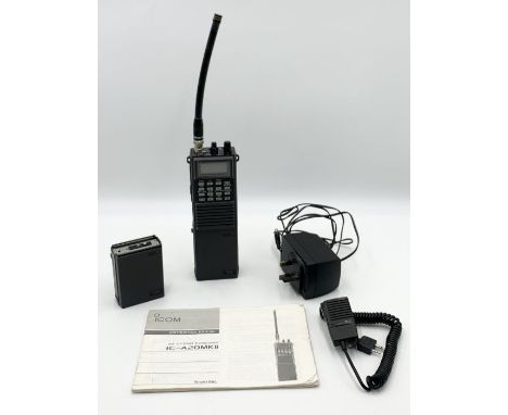 An Icom IC-A20 MKII handheld radio with instruction manual, charger, battery and speaker microphone