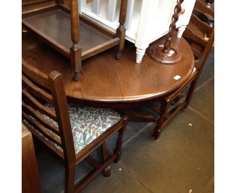 CIRCULAR OAK EXTENDING TABLE AND FOUR LADDER BACK CHAIRS. D107CM