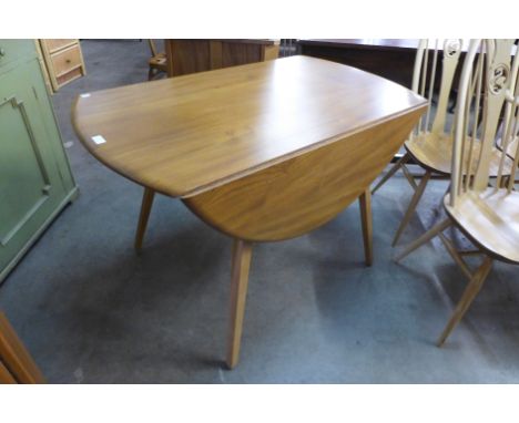 An Ercol Golden Dawn drop-leaf dining table 