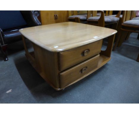 An Ercol elm Pandora's Box coffee table 