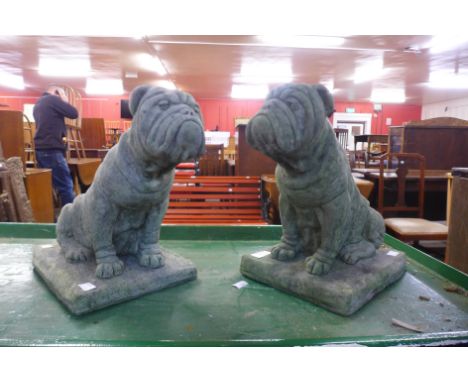 A pair of concrete bulldog garden figures 