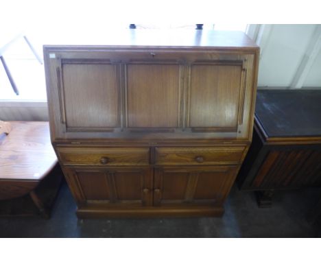 An Ercol Golden Dawn bureau 