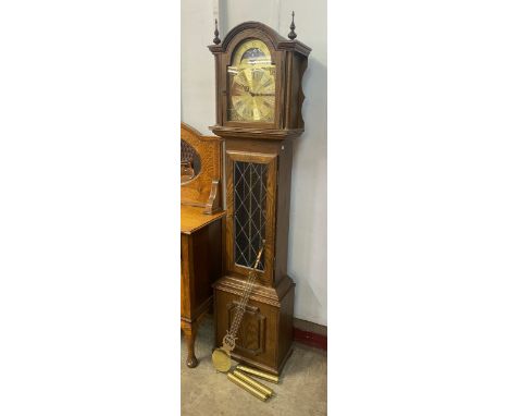 An oak longcase clock