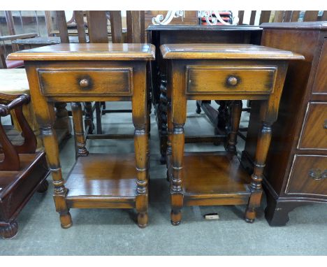 A pair of George III style Ipswich oak single drawer lamp tables 