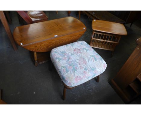 An Ercol drop-leaf coffee table, stool and a magazine rack 