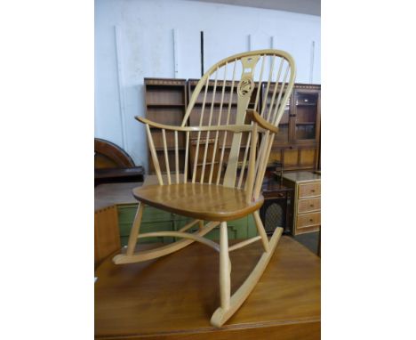 An Ercol blonde chairmakers rocking chair, model 949 