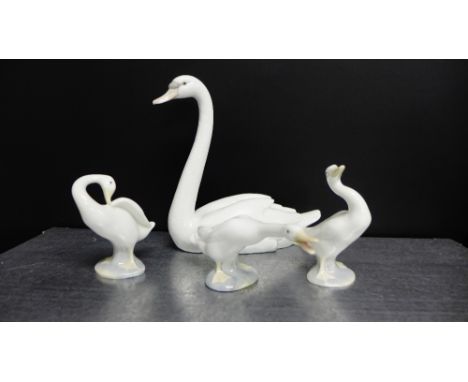 A Lladro figure of a swan together with three Lladro geese (4) 