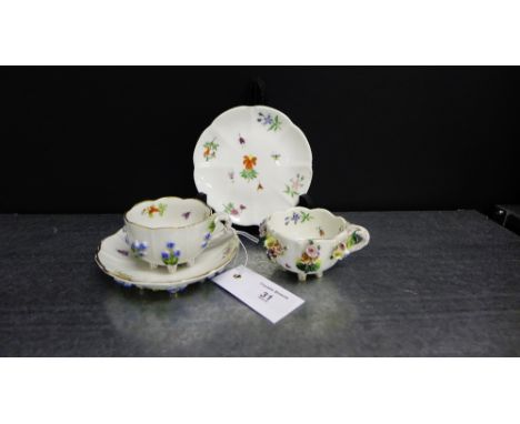 A pair of continental floral encrusted porcelain cabinet cups and saucers (2) 