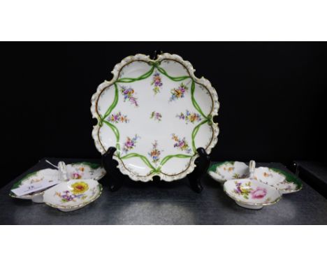 A Dresden porcelain dish painted with floral sprays in the Rococo manner together with a pair of continental porcelain triple