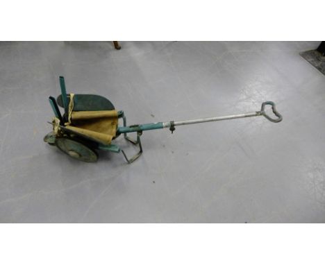 A vintage green painted metal buggy