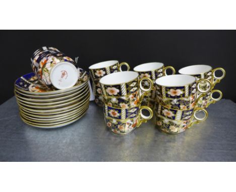 A set of twelve Royal Crown Derby Imari patterned coffee cans and saucers pattern No.2451 (24) 