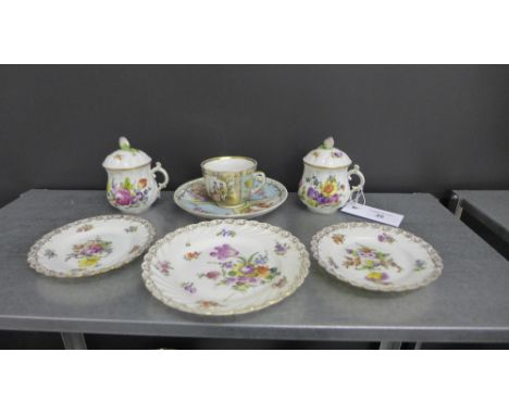 A collection of continental porcelains to include two covered cups with floral sprays another cabinet cup and saucer and thre