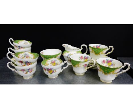 A Paragon fine bone china Rockingham pattern tea set comprising eight cups, eight saucers, a cream jug and sugar bowl (18) 