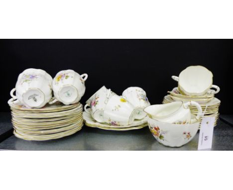 A Royal Crown Derby Posies pattern twelve place tea set comprising twelve cups, twelve saucers, twelve side plates, cream jug