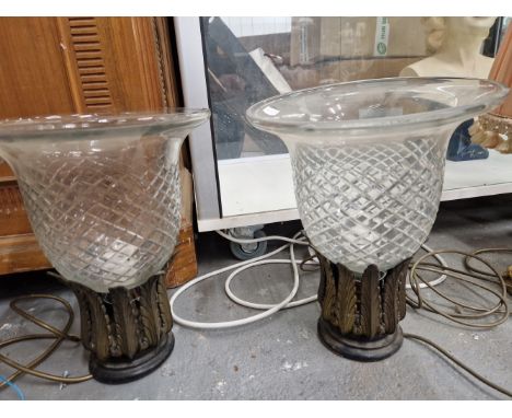 A PAIR OF TABLE LAMPS WITH SINGLE SOCKETS WITHIN GILT METAL LEAVES AND SUPPORTING CUT GLASS BELL SHAPED SHADES.   H 32cms. TO