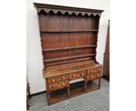 A 19th C. OAK DRESSER WITH AN ENCLOSED THREE SHELF BACK AND A FIVE DRAWER BASE ON BALUSTER TURNED LEGS