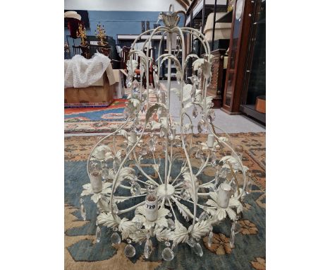 AN EIGHT LIGHT CHANDELIER, THE CREAM PAINTED FOLIATE WIRE WORK HUNG WITH PEAR SHAPED GLASS DROPS.   H 72cms.
