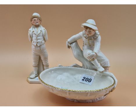 A VICTORIAN ROYAL WORCESTER FIGURE OF A BOY SEATED ON A BRANCH OVERLOOKING A GILT EDGED BASKET.   W 17cms. TOGETHER WITH A FI