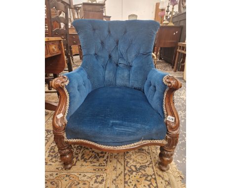 A VICTORIAN MAHOGANY ARM CHAIR BUTTON UPHOLSTERED IN BLUE VELVET