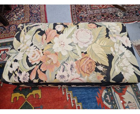 A FLORAL MACHINE WOVEN TAPESTRY COVERED OTTOMAN WITH A CUSHIONED RECTANGULAR LID.   W 145 x D 78 x H 44cms.