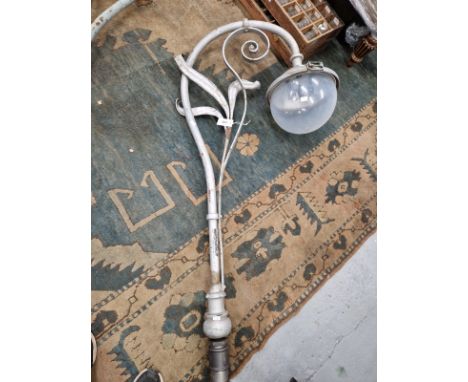 TWO SIMILAR VINTAGE&nbsp; STREET LIGHT HEADS, EACH LAMP HELD ON A CURVED ARM WITH THREE LEAVES FORMING BRACKETS WITHIN THE HO