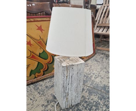 A RUSTIC STYLE WHITE PAINTED TABLE LAMP WITH SHADE.