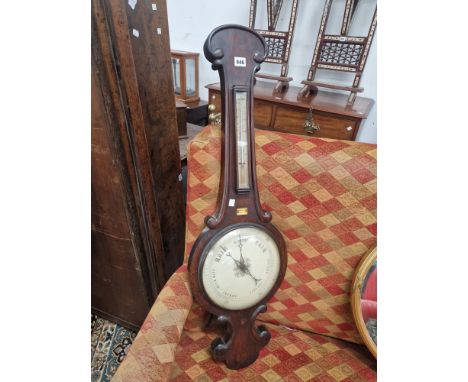 A ROSEWOOD BANJO BAROMETER LABELLED FOR MINORETTI OF LEICESTER WITH AN ALCOHOL THERMOMETER ABOVE THE WHITE DIAL