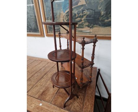 A MAHOGANY THREE TIER FOLDING CAKE STAND, A TOWEL RAIL AND A THREE SHELF WALL UNIT