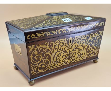 A BRASS INLAID ROSEWOOD SARCOPHAGUS SHAPED REGENCY TEA CADDY CONTAINING TWO CANISTERS AND A GLASS MIXING BOWL. W 32.5cms