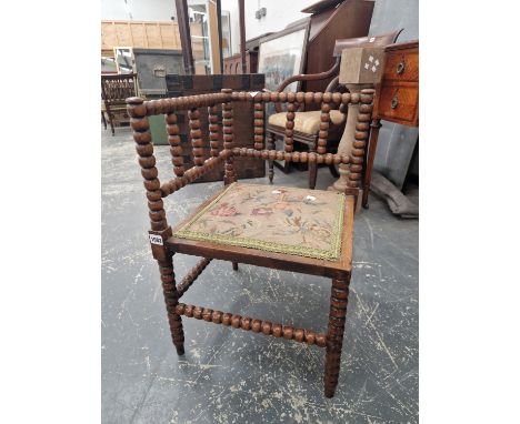 A VICTORIAN BOBBIN TURNED CORNER CHAIR.