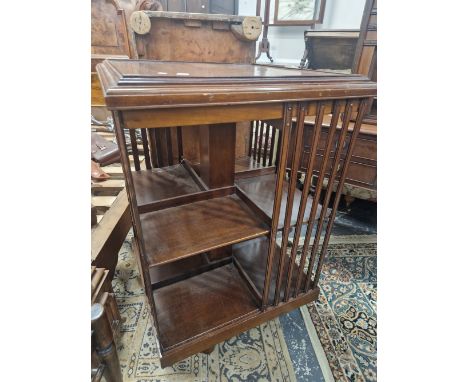 AN EARLY 20th C. MAHOGANY ROTARY BOOKCASE