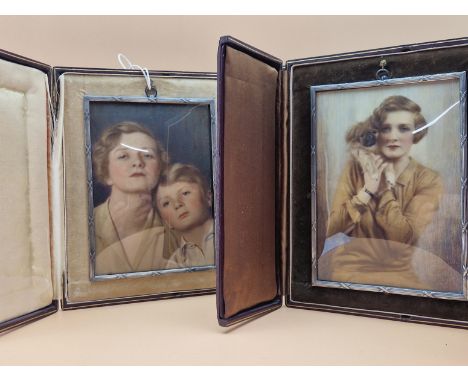 TWO PRE WWII EASEL BACKED LEATHER CASED OVER PAINTED PHOTOGRAPHIC MINIATURES OF A LADY, ONE FEATURING HER SON AND THE OTHER H