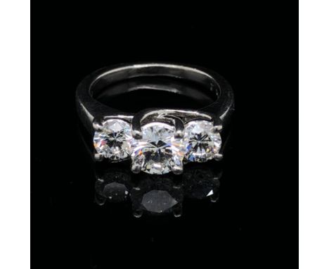 A THREE STONE DIAMOND TRILOGY RING. THE CENTRE DIAMOND APPROXIMATELY 1.02cts, THE TWO OUTER DIAMONDS 0.52cts . ALL THREE DIAM