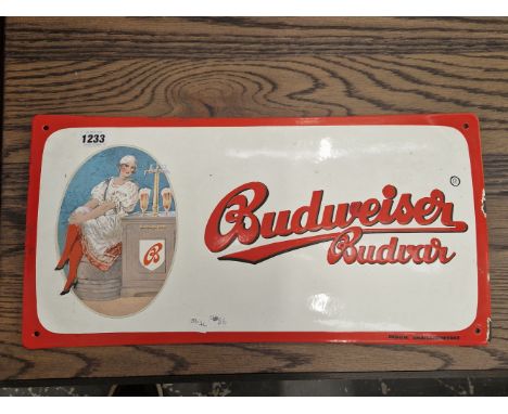A VINTAGE BUDWEISER ENAMEL ADVERTISING SIGN.