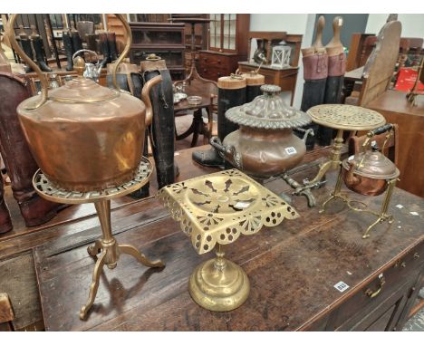 A COPPER EPERGNE, THREE BRASS TRIVETS, A COPPER KETTLE AND ANOTHER ON A BRASS STAND