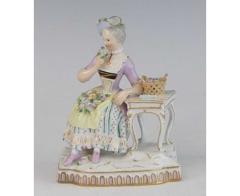 A Meissen porcelain figure of a lady, late 19th century, shown in 18th century dress, representing the sense of smell, underg