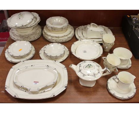 An Art Deco Alfred Meakin Marigold pattern part tea and dinner service, with silvered geometric decoration 