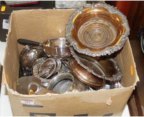 A box of silver plated items, to include a pair of bottle coasters, tea caddy and loose flatware 