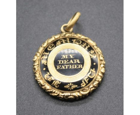 A Victorian yellow metal and black enamel mourning pendant, annotated 'In memory of my dear Father', the reverse with plaited