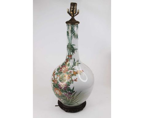 A large Chinese bottle vase on hardwood stand, enamel decorated with flowers, converted into a table lamp, h.61cm (including 